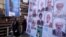 Women walk past electoral posters for the upcoming elections in central Tehran, Iran, Feb. 24, 2016.
