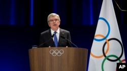 FILE - International Olympic Committee president Thomas Bach addresses the audience during the 142nd IOC session at the 2024 Summer Olympics, in Paris, Aug. 10, 2024.
