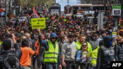 Construction workers and demonstrators attend a protest against Covid-19 regulations in Melbourne, Australia, Sept. 21, 2021. 