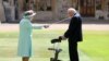 Captain Sir Thomas Moore, who raised 39 million pounds ($53 million) for health service charities by walking laps of his Bedfordshire garden, receives his knighthood from Britain's Queen Elizabeth at Windsor Castle in Windsor, England, July 17, 2020.