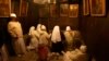 FILE - Christian pilgrim worshippers from Nigeria pray in the Grotto of the Church of Nativity in the West Bank town of Bethlehem on Christmas Eve, Dec. 24, 2013.