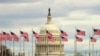Flags fly in front of the U.S. Capitol in Washington, Jan. 1, 2019, as a partial government shutdown stretches into its third week. 