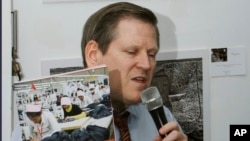 Former Nazi concentration camp survivor Petro Fedorowitsch Mischuk of Ukraine holds his uniform cap during the commemoration ceremonies for the 72th anniversary of the liberation of former Nazi concentration camp Mittelbau-Dora near Nordhausen, central Germany.