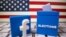 FILE PHOTO: A 3D-printed elections box and Facebook logo are placed on a keyboard in front of U.S. flag in this illustration taken Oct. 6, 2020. 