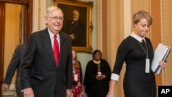 Senate Majority Leader Mitch McConnell, R-Ky., walks from the Senate chamber as the impeachment trial of President Donald Trump concludes on Capitol Hill in Washington, early Wednesday, Jan. 22, 2020.