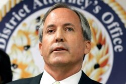 FILE - Texas Attorney General Ken Paxton speaks at a news conference in Dallas, June 22, 2017.