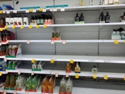 Empty shelves are pictured at Coles Supermarket following reports of coronavirus in the Canberra suburb of Manuka, Australia, March 2, 2020 in this picture obtained by Reuters from social media. (Adam Spence via Reuters)