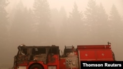 A fire-damaged firetruck sits in the aftermath of the Beachie Creek fire in Detroit, Oregon, Sept. 14, 2020.