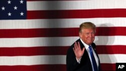 FILE - Republican presidential candidate Donald Trump waves during a campaign event in Lawrenceville, New Jersey, May 19, 2016. Trump is targeting former President Bill Clinton in an attempt to undermine Hillary Clinton’s presidential campaign.