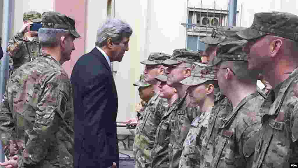 Secretary of State Kerry greets U.S. troops outside Resolute Support Headquarters following a meeting with General "Mick" Nicholson, commander of U.S. forces in Afghanistan , April 9, 2016. (Pamela Dockins/VOA)