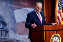 FILE - Senate Minority Leader Sen. Chuck Schumer of N.Y. speaks on Capitol Hill in Washington, Dec. 1, 2020.