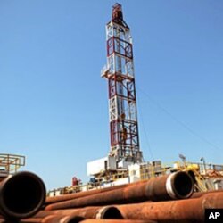 Drilling tubing is piled next to the drilling site number 102 in the Unity oil field in South Sudan (2010 file photo).