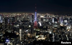 Tokyo Tower is illuminated in blue, white and red, the colors of the French flag in response to the Paris attacks, in Tokyo, Japan, November 15, 2015.