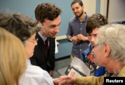 Democratic candidate Jon Ossoff greets supporters in Marietta, Georgia, April 3, 2017.