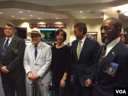 Far left and right: former Marines who were in Havana to lower flag 54 years ago and who will help raise it today. Also pictured: Assistant Secretary of State for Western Hemisphere Affairs Roberta Jacobson, Tennessee Congressman Steve Cohen and Arizona Senator Jeff Flake. (Photo: Pam Dockins / VOA)