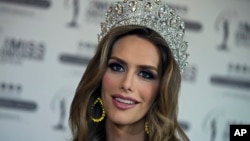 Angela Ponce, who won Spain's Miss Universe competition in June, speaks during an interview with The Associated Press in Madrid, Spain, July 10, 2018.