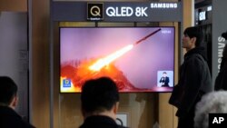 FILE - A TV screen shows a file image of North Korea's missile launch during a news program at the Seoul Railway Station in Seoul, South Korea, Feb. 2, 2024.