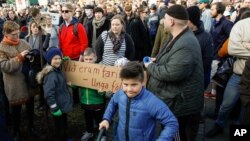 People gather to demonstrate against Iceland's prime minister, in Reykjavik on April 4, 2016. 