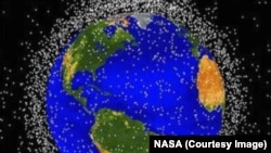 NASA tracks more than 500,000 pieces of space debris as they orbit the Earth, each represented here by a dot. Debris is a danger, but harmful particles may be a bigger danger.