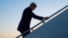 FILE - Secretary of State John Kerry walks up the stairs to board his aircraft at Andrews Air Force Base, Maryland, Aug. 14, 2015.