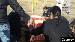 Scene from the funeral of a Cheyenne River Sioux Tribe elder, Red Scaffold, S.D., Dec. 8, 2020.
