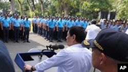 Philippine President Rodrigo Duterte speaks to police during an audience at the Presidential Palace grounds in Manila, Philippines, on Feburary 9, 2017. Duterte said he would send them to a southern island to fight extremists dreaded for beheadings. He recently banned the national police from carrying out his anti-drug campaign. (King Rodriguez/Presidential Photographers Division, Malacanang Palace via AP)