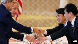 John Kerry and Chuck Hagel shake hands with Itsunori Onodera and Fumio Kishida, before the Japan-US 2+2 meeting in Tokyo, Oct. 3, 2013.