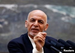 FILE - Afghan President Ashraf Ghani speaks during a news conference in Kabul.
