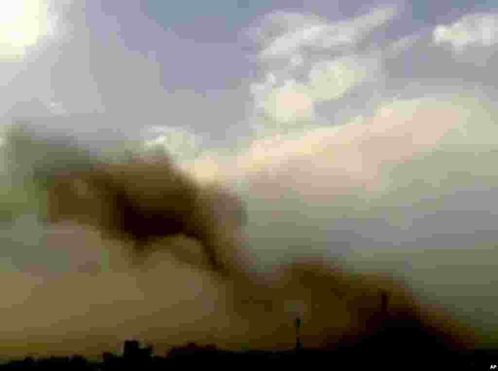 This image taken from video obtained from the Shaam News Network purports to show smoke rising from buildings following a huge explosion in Saadallah al-Jabri Square in Aleppo, Syria, October 3, 2012. 