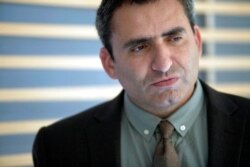 FILE - Zeev Elkin, then the Israeli deputy foreign minister, listens during an interview with The Associated Press, in Jerusalem, May 26, 2013.