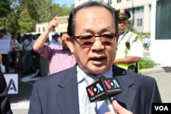 FILE: Kuch Schanly, a Cambodian American analyst in Maryland, talked to VOA Khmer during a protesters where about 200 Cambodian Americans demand respect of human rights and democracy and the release of Kem Sokha, CNRP president, in front of State Department, Washington DC, on September 15, 2017. (Say Mony/VOA Khmer)