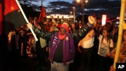 Supporters of opposition presidential candidate Salvador Nasralla protest outside the U.S. Embassy in Tegucigalpa, Honduras, Friday Dec.15, 2017. (AP Photo/Fernando Antonio)