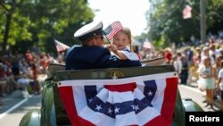Michael Mays, left, of Cockeysville, Md., and Samuel Koch, of Reisterstown, Md., watch the firework display during the Baltimore County Independence Extravaganza, Wednesday, July 3, 2019, in Cockeysville.