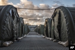 FILE - A new migrant reception camp is seen in Vordingborg, 100 km south of Copenhagen, Denmark, Nov. 26, 2015. The camp has the capacity to hold up to 2,000 people.