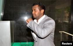 FILE - Yacqub Khayre walks from a court appearance in Melbourne, Australia in this Dec. 23, 2010, picture.