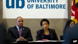 U.S. Attorney General Loretta Lynch, right, speaks with members of Congress and faith leaders at the University of Baltimore, in Maryland, May 5, 2015. 