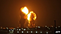 Two balls of fire are seen following an Israel airstrike in Khan Yunis in the southern Gaza Strip early Nov. 15, 2019.