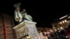 Candles are placed around the Brothers Grimm monument during a vigil for the victims of a shooting in Hanau, near Frankfurt, Germany, Feb. 20, 2020.