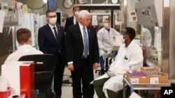 Vice President Mike Pence visits the molecular testing lab at Mayo Clinic in Rochester, Minn., where he toured the facilities supporting COVID-19 research and treatment, April 28, 2020.