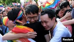 Same-sex marriage supporters celebrate after Taiwan became the first place in Asia to legalize same-sex marriage, outside the Legislative Yuan in Taipei, Taiwan May 17, 2019. (REUTERS/Tyrone Siu)