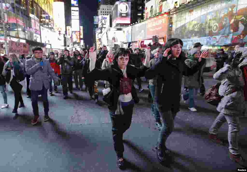 Demonstrators in Times Square protest a grand jury decision not to charge a New York policeman in the chocking death of Eric Garner in New York, Dec. 4, 2014.