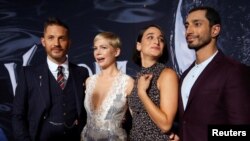 Cast members, from left, Tom Hardy, Michelle Williams, Jenny Slate and Riz Ahmed attend the premiere for the movie "Venom" in Los Angeles, Oct. 1, 2018.