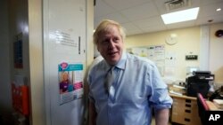 Prime Minister Boris Johnson visits Bassetlaw District General Hospital, during their General Election campaign in Worksop, England, Nov. 22, 2019. Voters face a stark choice in the country’s Dec. 12 election.