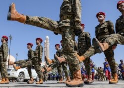 Houthi soldiers march during a funeral procession for Houthi fighters killed in recent fighting against government forces in Marib province, in Sanaa, Yemen, Feb. 17, 2021.