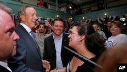 Former New York Gov. George Pataki greets supporters in Exeter, N.H., after announcing his plans to seek the Republican nomination for president, May 28, 2015.
