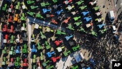 FILE - Protesting farmers with their tractors take part in a rally in Thessaloniki, Greece, on Feb. 1, 2024. The European Union's executive arm on March 15 proposed to sacrifice more climate and environmental measures in the bloc's latest set of concessions to farmers.