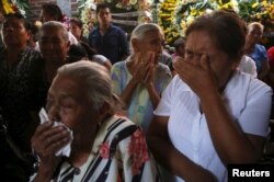 Residents react during the funeral of newly-installed Temixco mayor Gisela Mota in Temixco, south of Mexico City, after Mota was shot dead on Saturday by four armed gunmen.