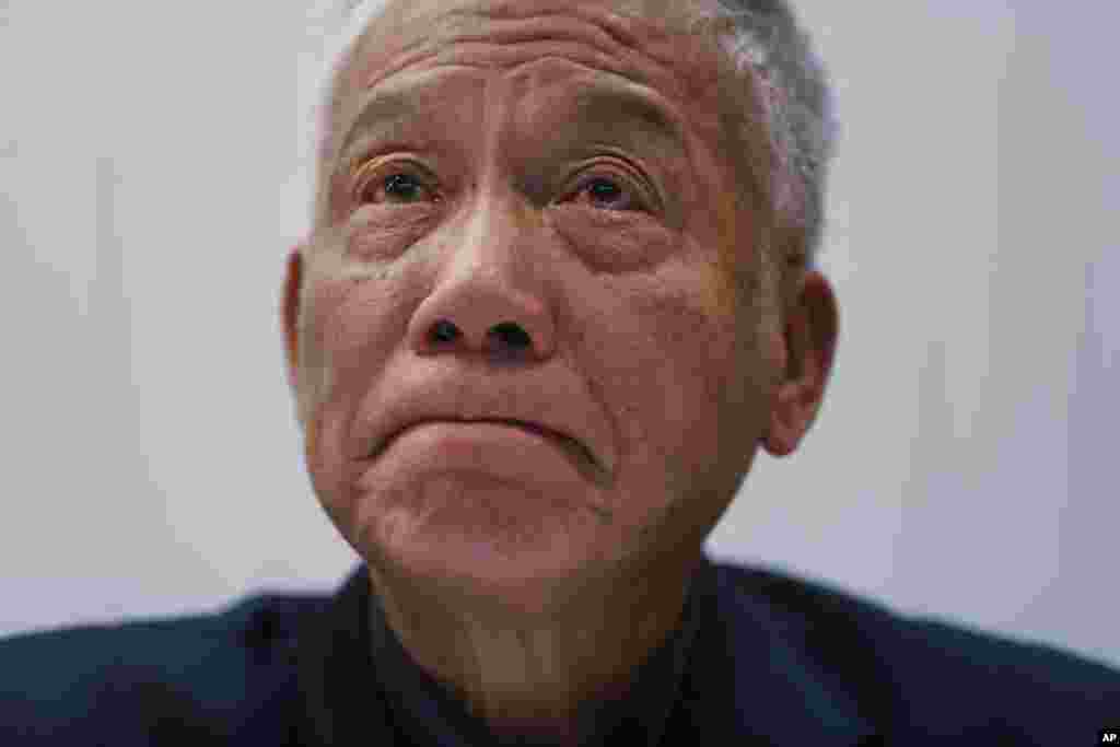 One of three protest leaders, Reverend Chu Yiu-ming,&nbsp; weeps as he announces that he and two other pro-democracy leaders will surrender to police, during a news conference, in Hong Kong, Dec. 2, 2014.