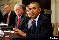 FILE - Then-President Barack Obama meets with health insurance chief executives at the White House in Washington, Nov. 15, 2013.