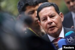 FILE - Brazil's Vice President Hamilton Mourao speaks to the media in Bogota, Colombia, Feb. 25, 2019.